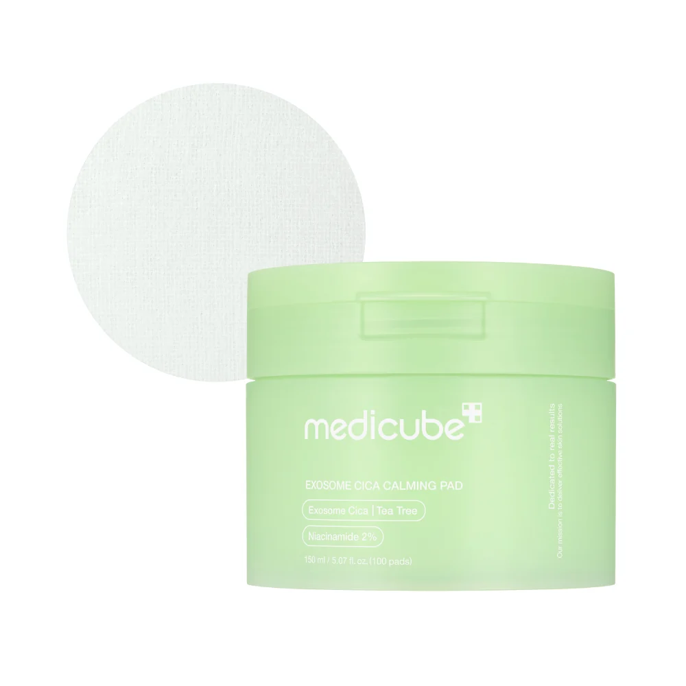 Medicube Exosome Cica Calming Pad jar in a soft pastel green with a single cotton pad displayed above.